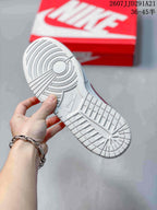 Bottom view showing the textured white rubber outsole with circular and block tread sections.