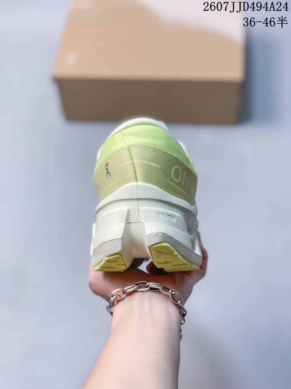 Rear view of the lime green and white sneaker showing the padded heel and outsole structure.