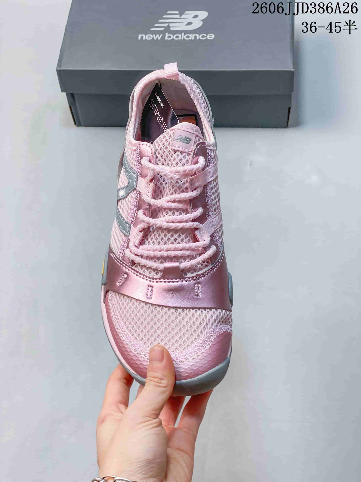 Top view of a pink lace-up sneaker with a mesh-textured toe box and silver-gray detailing.