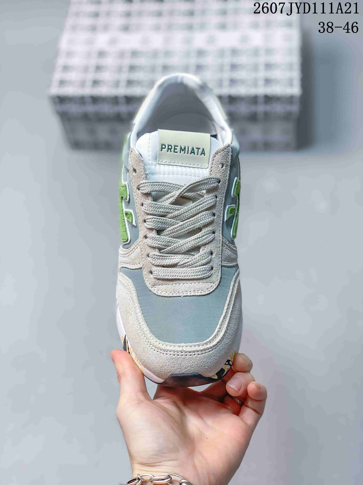 Front view of the sneaker showing gray laces, a padded tongue, and the Premiata branding.