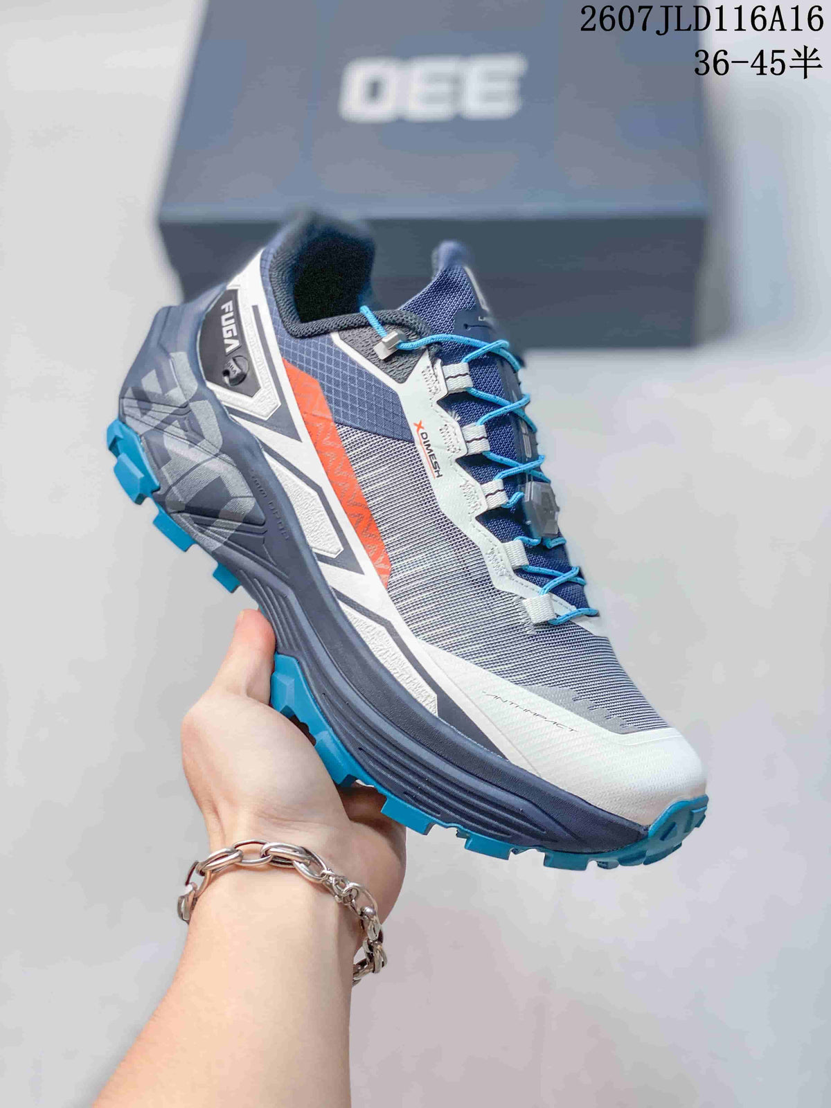 Angled side view of the KAILAS FUGA EX330 shoe with blue laces, gray mesh-style panels, orange accent, and lugged outsole.