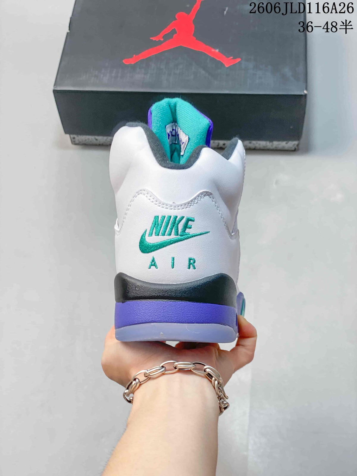 Rear view of a white Jordan high-top sneaker with teal heel branding and purple accents