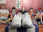 Front view of white basketball shoes with grey and black details