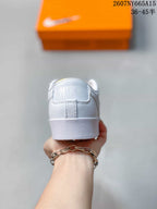 Rear view showing the white heel panel, Nike detail and textured outsole.