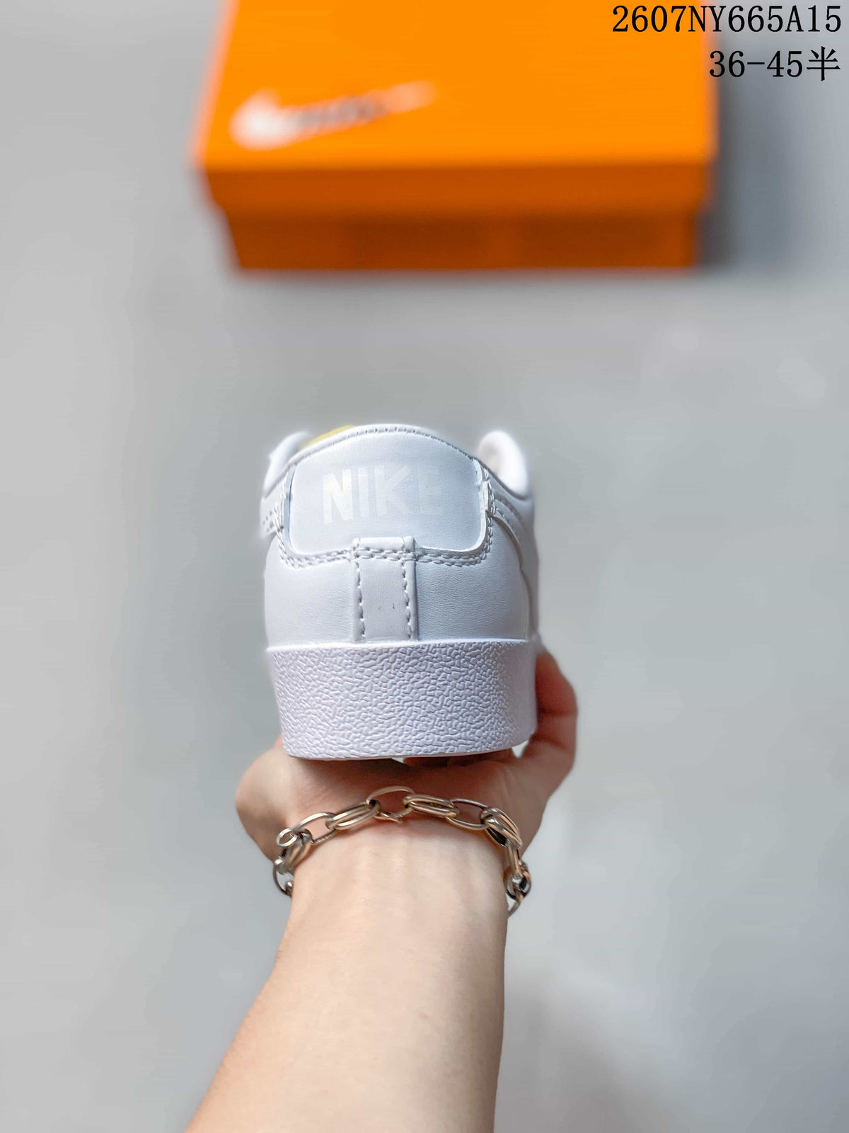 Rear view showing the white heel panel, Nike detail and textured outsole.