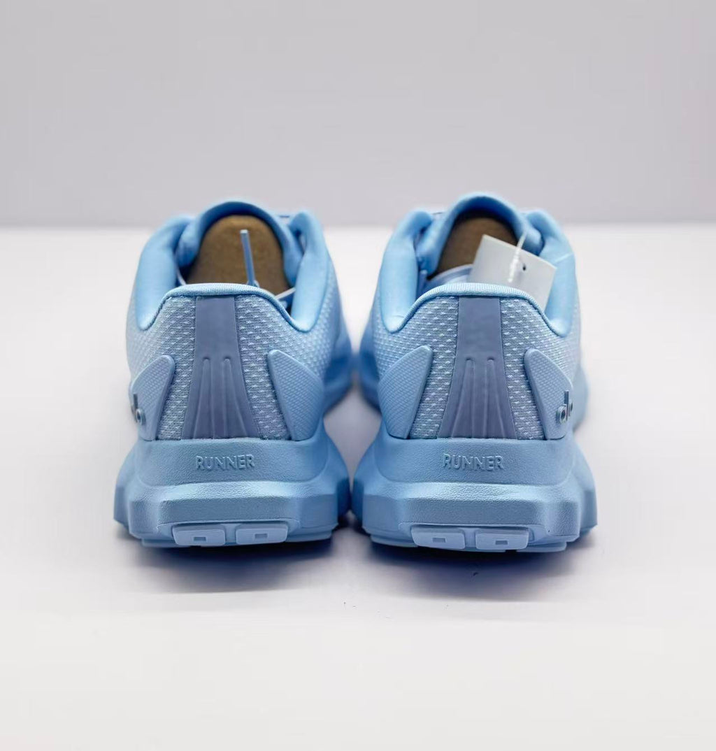 Rear view of the sneakers showing RUNNER text on both heels and the outsole blocks.