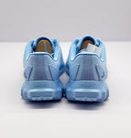 Rear view of the sneakers showing RUNNER text on both heels and the outsole blocks.