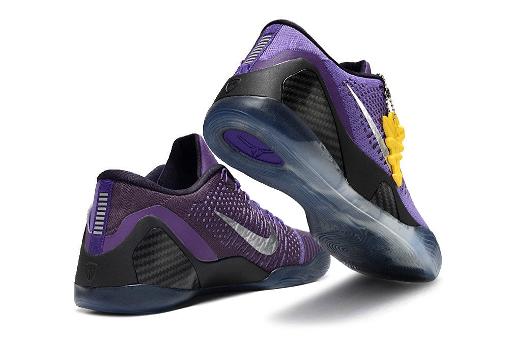 Purple and black shoes shown from the heel and outsole.