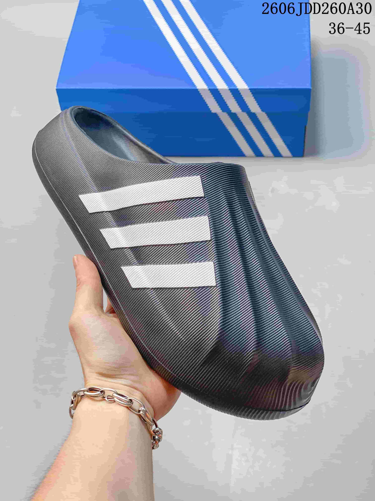Close-up of the charcoal mule showing its sculpted ridges and light side stripes.