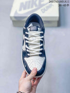 Top view showing white laces, perforated white toe box, navy overlays, and OFF-WHITE-branded tongue label.