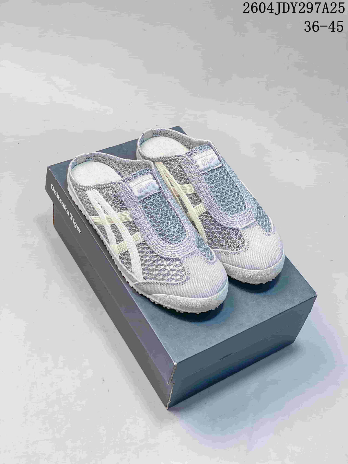 Pair of gray and white Onitsuka Tiger Mexico 66 Sabot sneakers displayed on a shoebox.