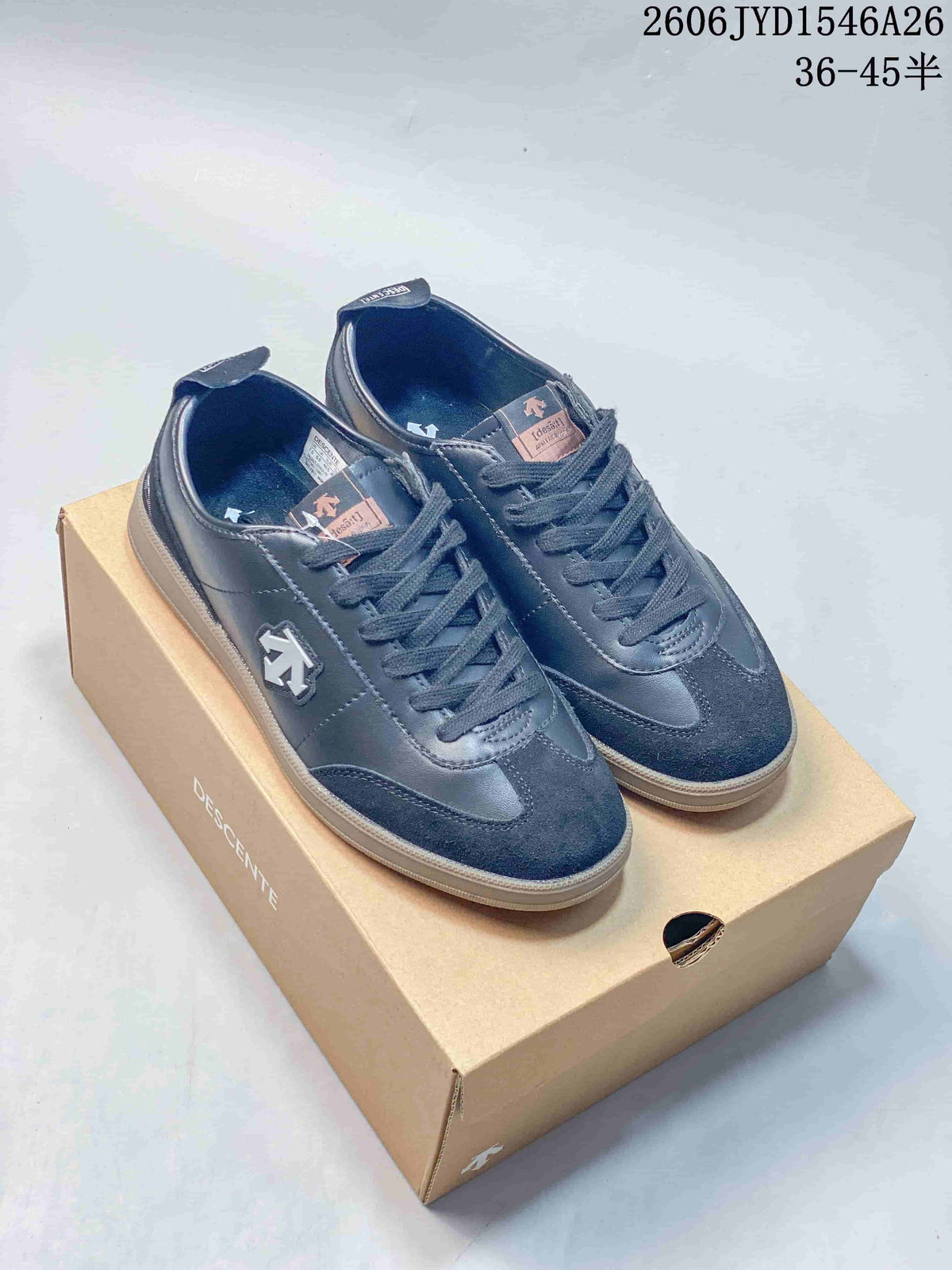 Pair of dark navy low-top sneakers with contrasting panels and side emblems