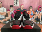 Front view of white, black, and red Jordan Flight basketball sneakers