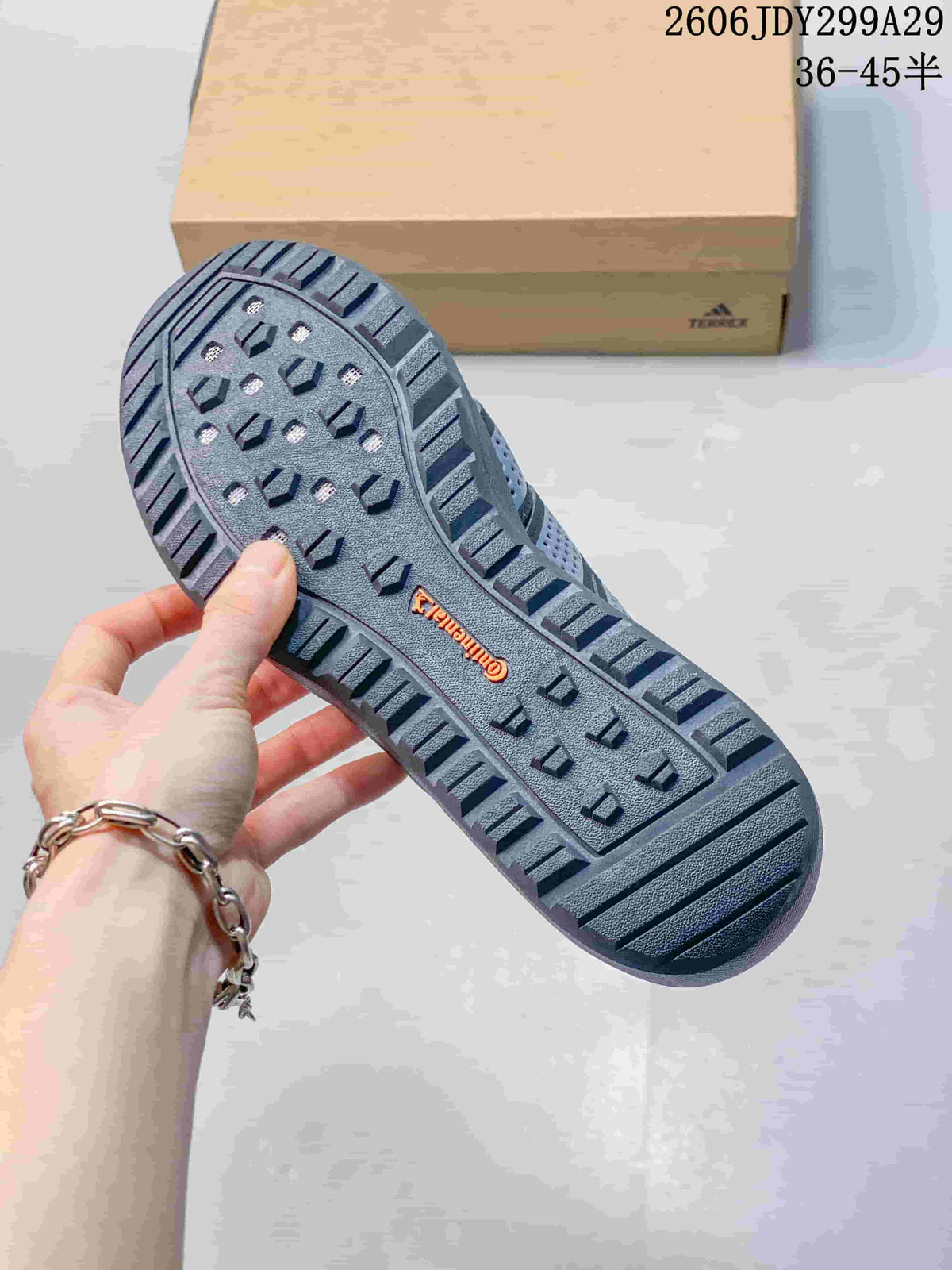 Close view of the patterned rubber outsole with raised traction grooves and a Terrex marking; the size range 36–45 is shown above.