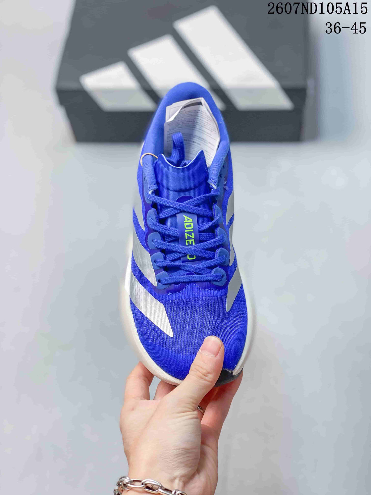 Top view of the blue lace-up sneaker with Adizero branding on the tongue and a mesh-like upper surface.