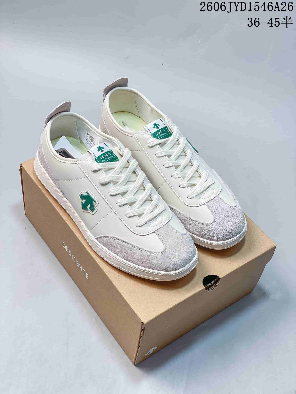 Pair of white and pale gray low-top sneakers with green accents