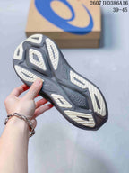 Bottom view of the sneaker showing the sculpted outsole with light-colored traction sections.