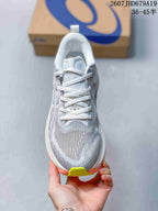Top view of a gray and white ASICS Superblast 2 running shoe with white laces and lime toe accent.