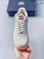 Top view showing the woven toe box, tonal laces, and burgundy tongue label.