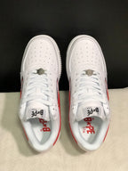 Top view showing perforated white toe boxes, white laces, metal lace hardware and BAPE STA tongue branding.