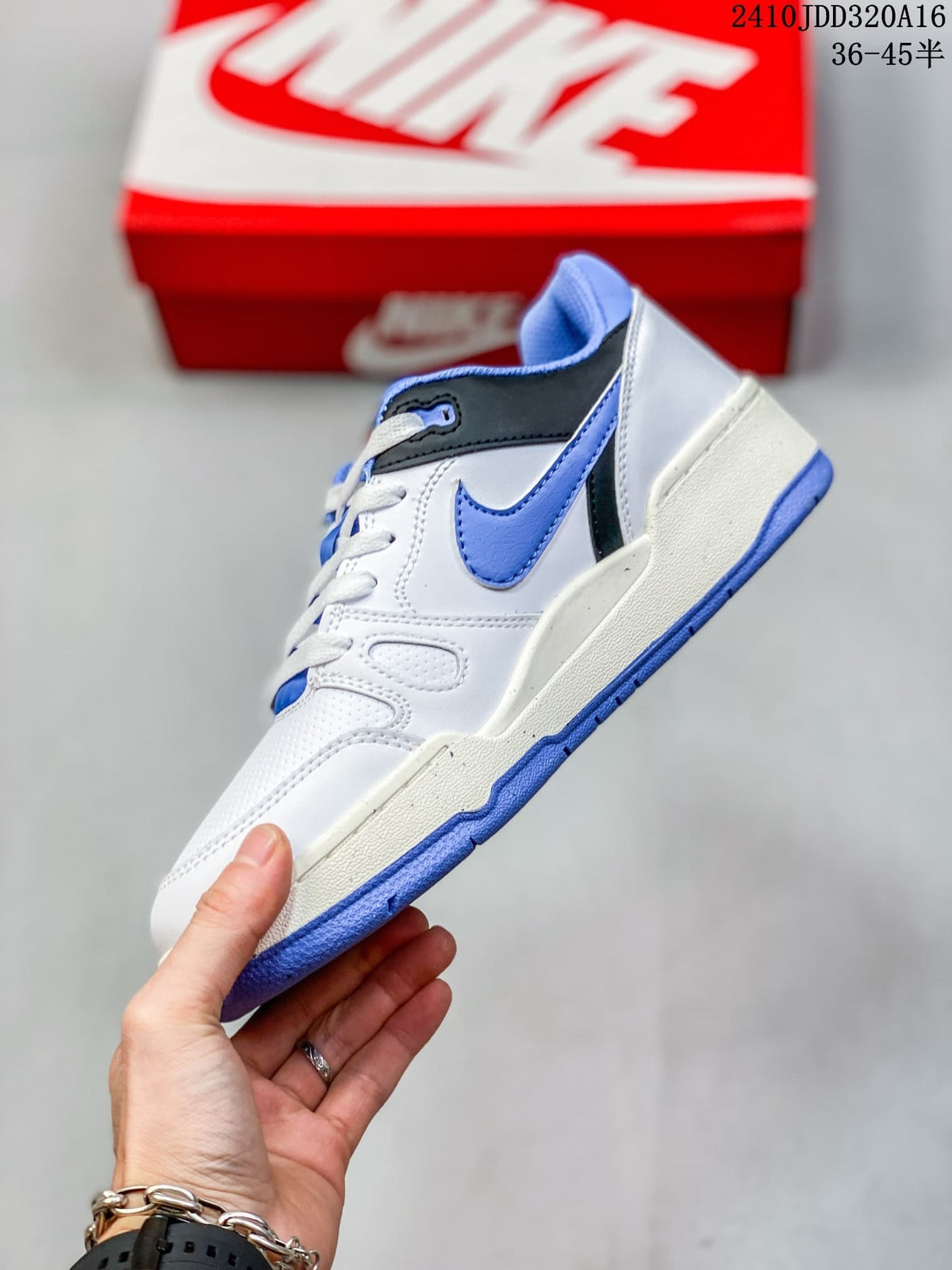 Side view of the Nike Full Force LO sneaker showing the blue Swoosh, black heel detail, white upper and blue outsole.