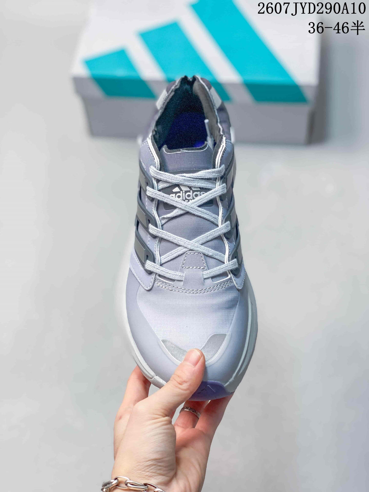 Top view of the adidas shoe showing the gray upper, light-colored laces, padded collar and contrasting toe details.