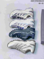 Top-down display of four KAILAS hiking shoe colorways, including light gray, white with blue accents, dark charcoal, and white with gray accents.
