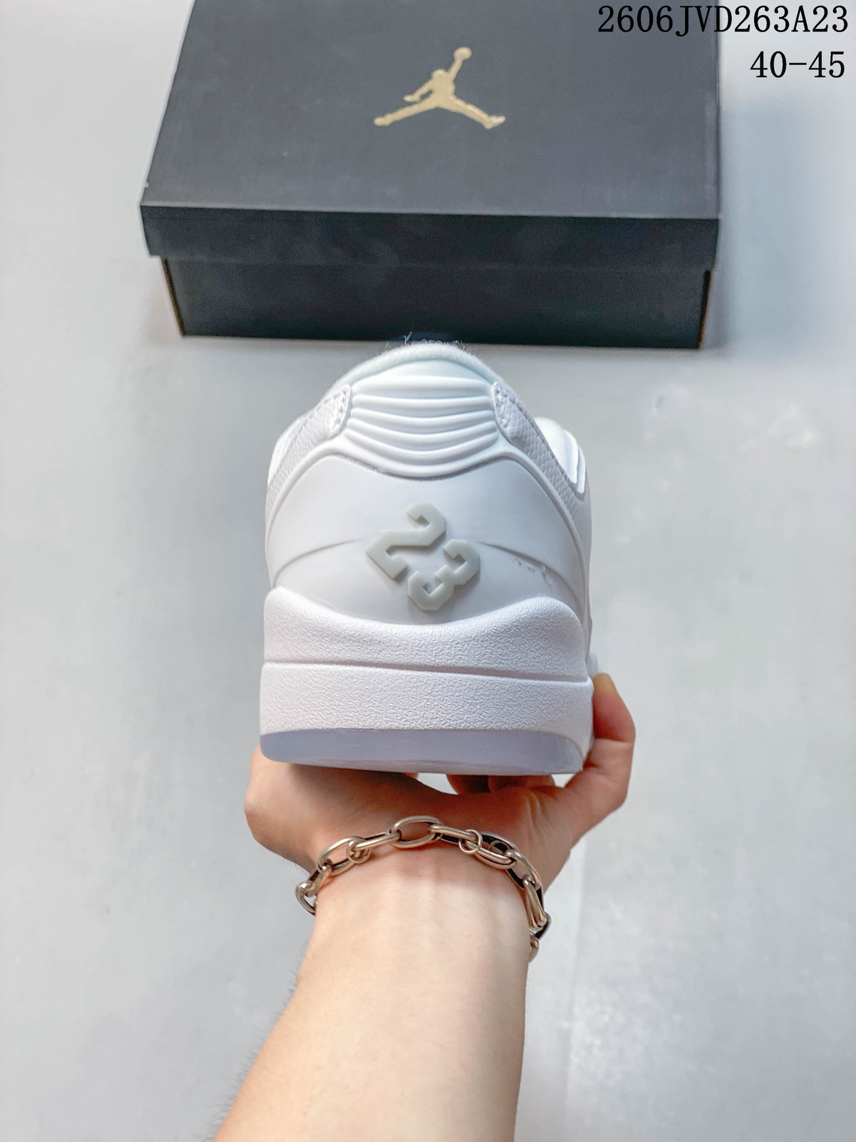 Rear view of a white Jordan sneaker showing heel details and the sole