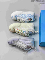 Side view of the three pictured Ouder sneaker color variations: blue-and-white, off-white, and silver.