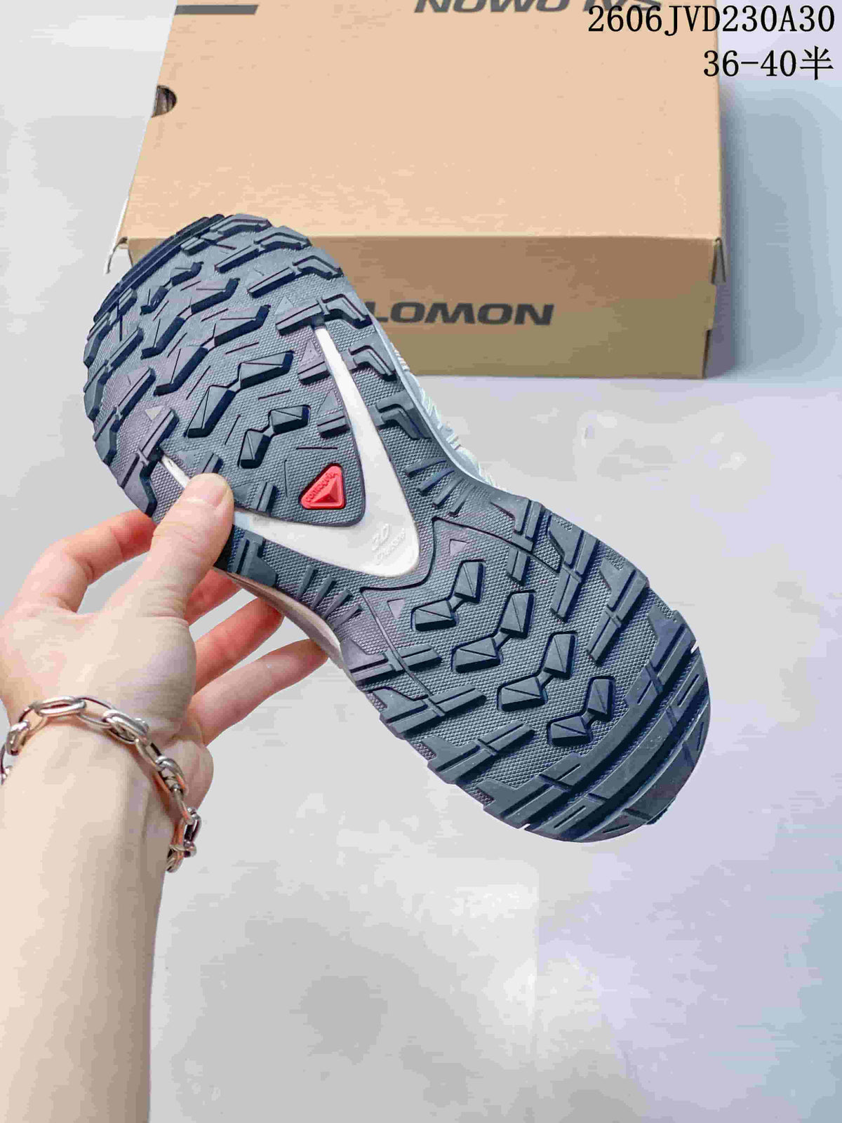 Close-up of the deeply patterned outsole on a Salomon XA Pro 3D shoe