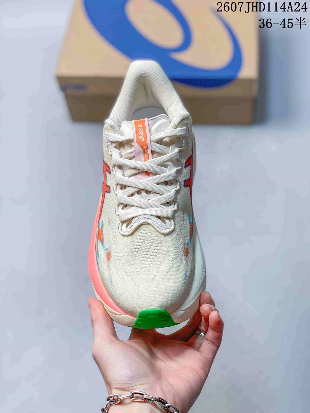 Top view of the cream sneaker showing white laces, padded tongue and orange ASICS tongue label; image text shows 2607JHD114A24 and 36–45 half sizes.
