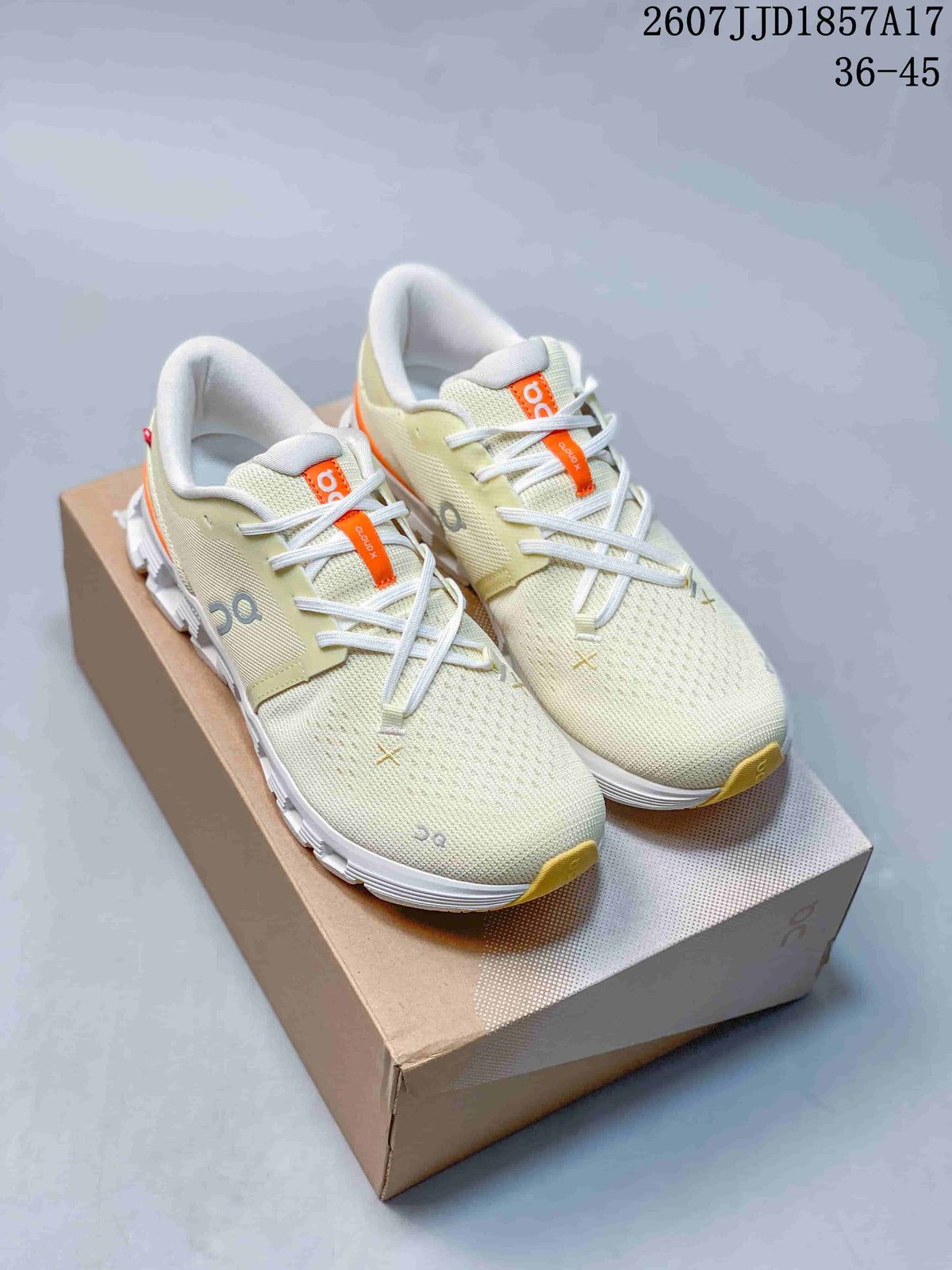 Light green and white On Cloud X 4 sneakers displayed on a shoebox.