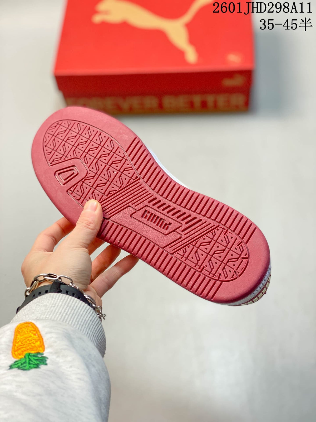 Close view of the red patterned outsole with Puma branding.