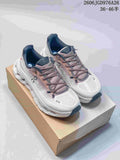 Pair of white and mauve On Cloudtilt sneakers shown on a shoebox.