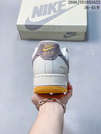 Rear view showing the ivory heel, mauve heel tab, and gum-yellow outsole.