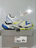 White, blue and yellow Nike 9074 Runner 2 sneaker displayed on its box; the box label shows size E 40.