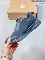 Side view of a dark gray low-top shoe with dial closure