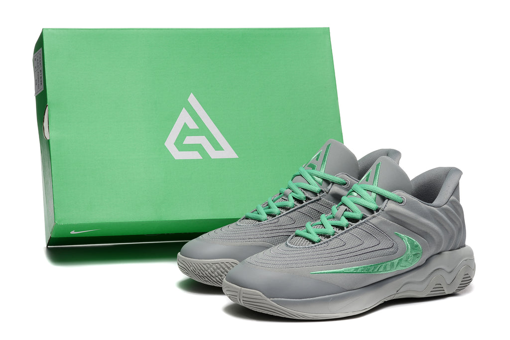 Gray and mint-green sneakers pictured beside a green shoe box
