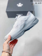 Side view of the low-top sneaker showing the perforated upper, sculpted midsole, and heel structure.