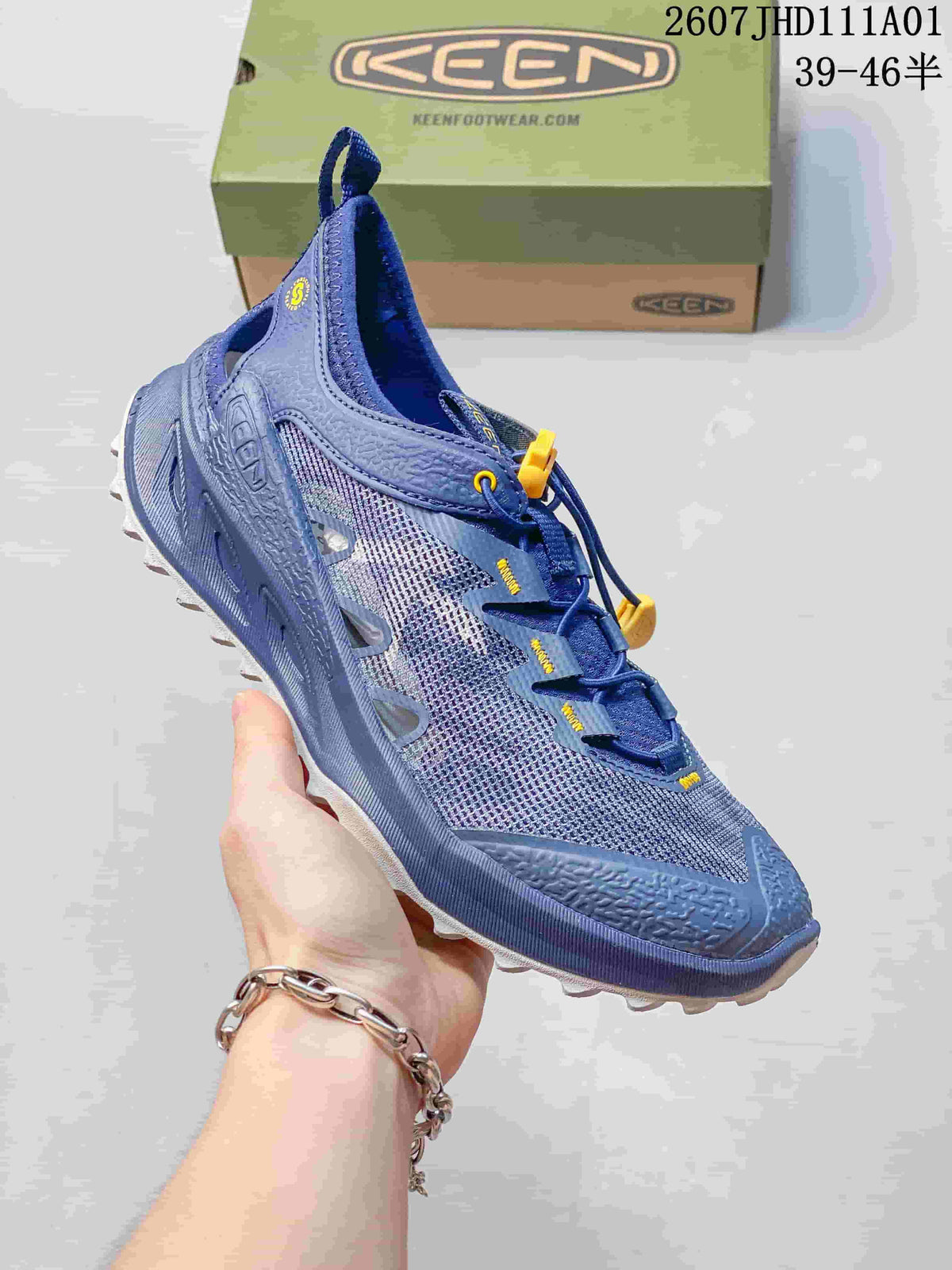 Angled side view of the blue hiking shoe with open mesh panels