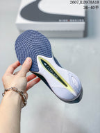Close view of the sneaker outsole showing textured dark rubber and a visible Flyplate marking.