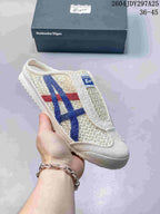 Cream Onitsuka Tiger Mexico 66 Sabot sneaker with blue and red side stripes, shown with its box; the image shows style code 2604JDY297A25 and size range 36–45.