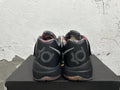 Rear view of black basketball shoes with patterned collars and KD-style heel branding.
