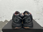 Rear view of black basketball shoes with patterned collars and KD-style heel branding.