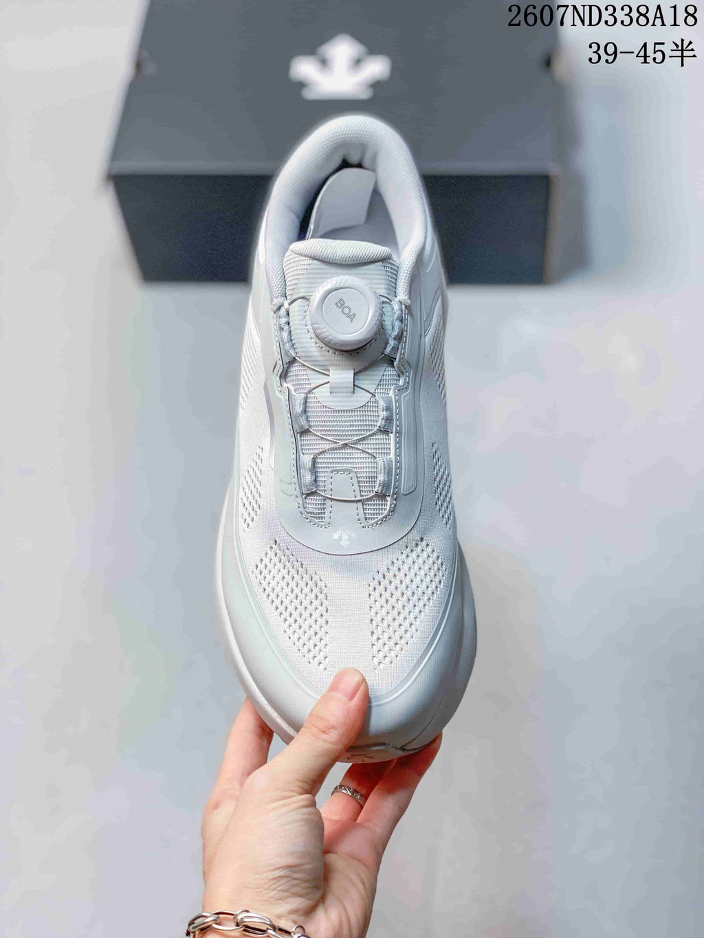 Top view of the white sneaker showing the perforated mesh toe area and BOA dial closure.