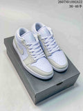 Pair of light lavender and white low-top Jordan sneakers displayed on a shoe box.