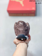 Rear view of the brown sneaker showing the padded heel area, Puma logo and layered outsole.