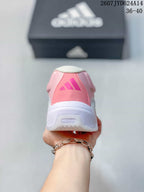 Rear view showing the pink heel panel, adidas logo and white midsole.