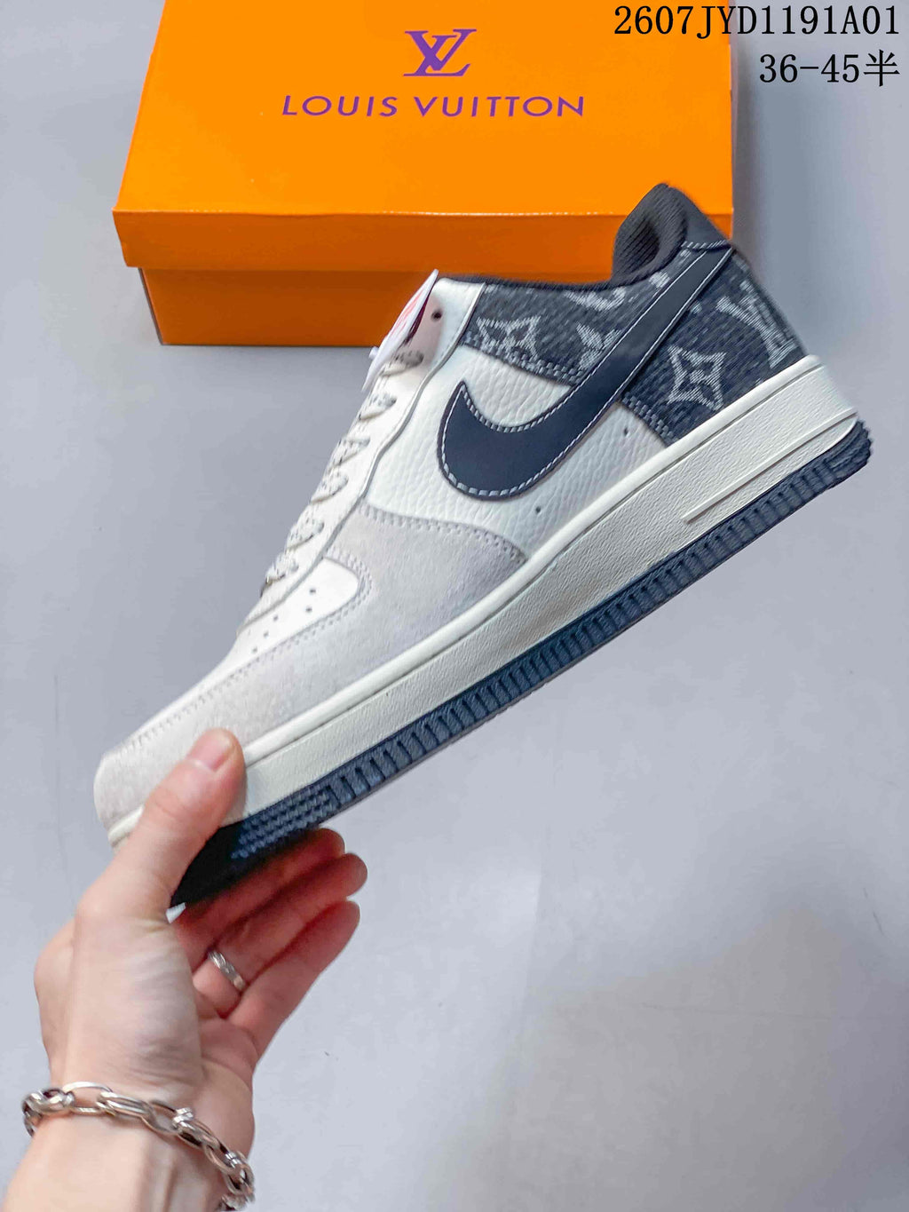Side view of the low-top sneaker with dark patterned panels and white upper
