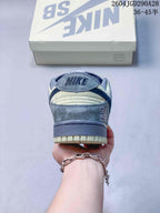 Rear view of the grey and cream sneaker with a branded heel tab